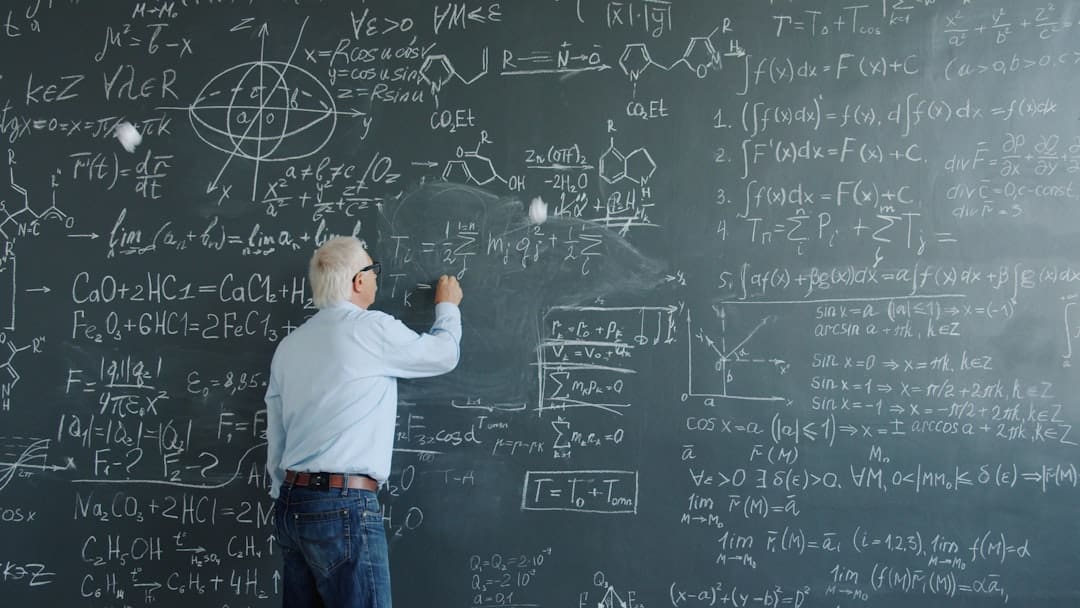 cats support animals. Professor writing complex equations on a blackboard.