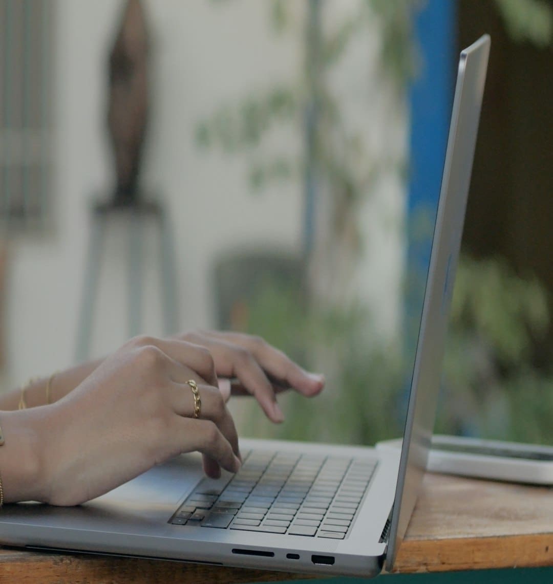 support animal qualification — a woman using a laptop computer on a wooden table