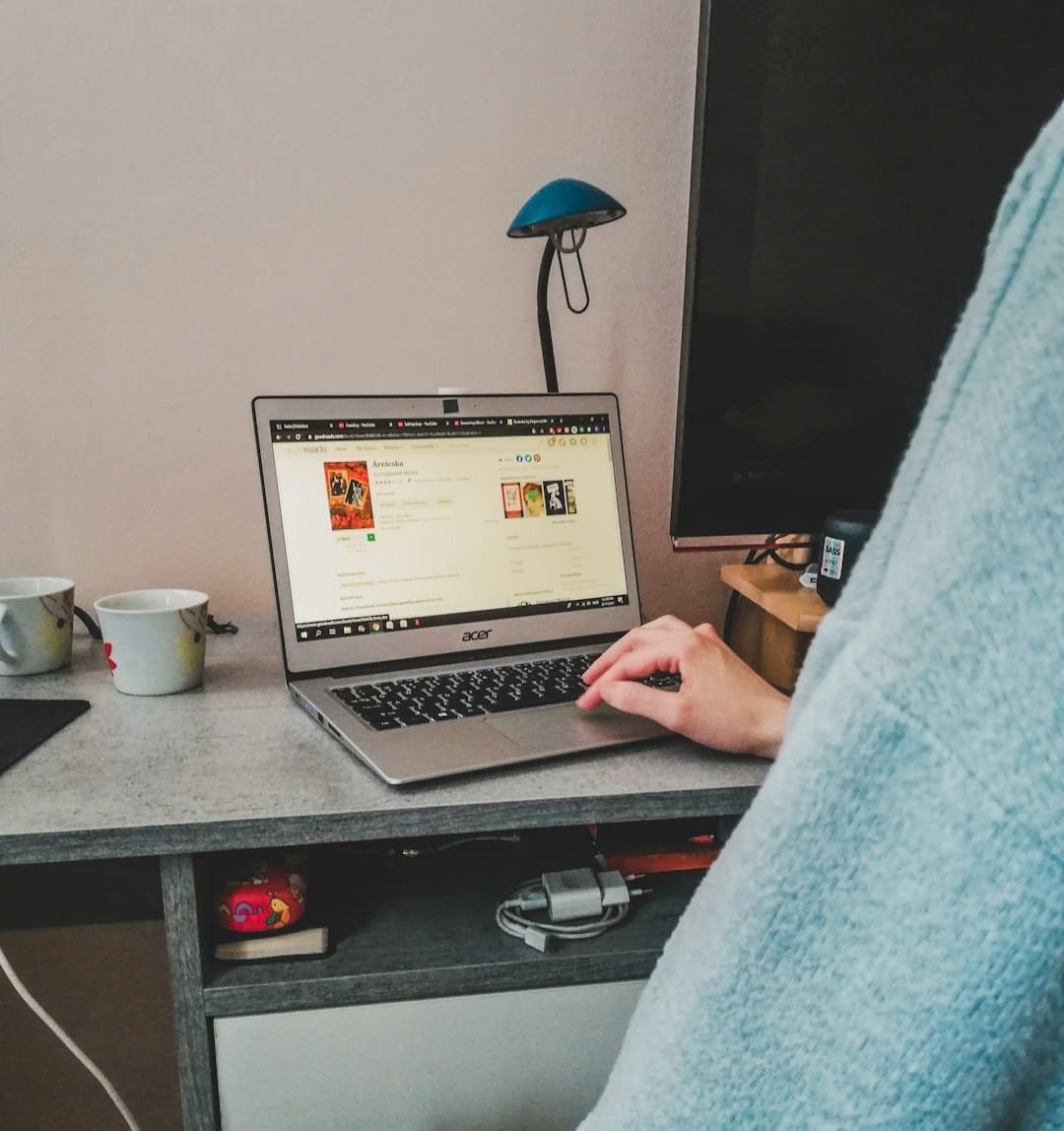 rescue support animal — a person sitting in front of a laptop computer