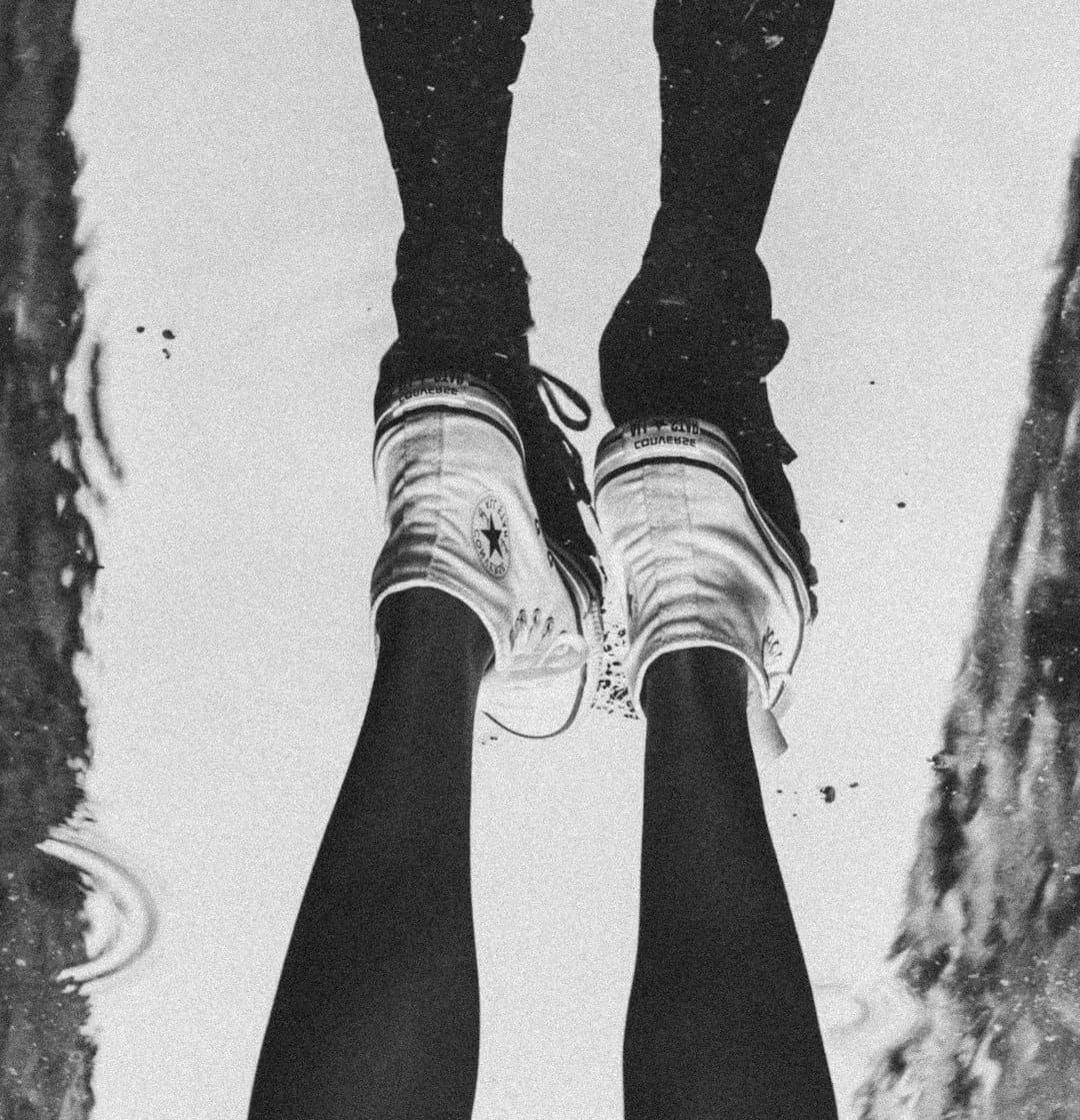 support animal rights — a person standing in a puddle with their feet in the water
